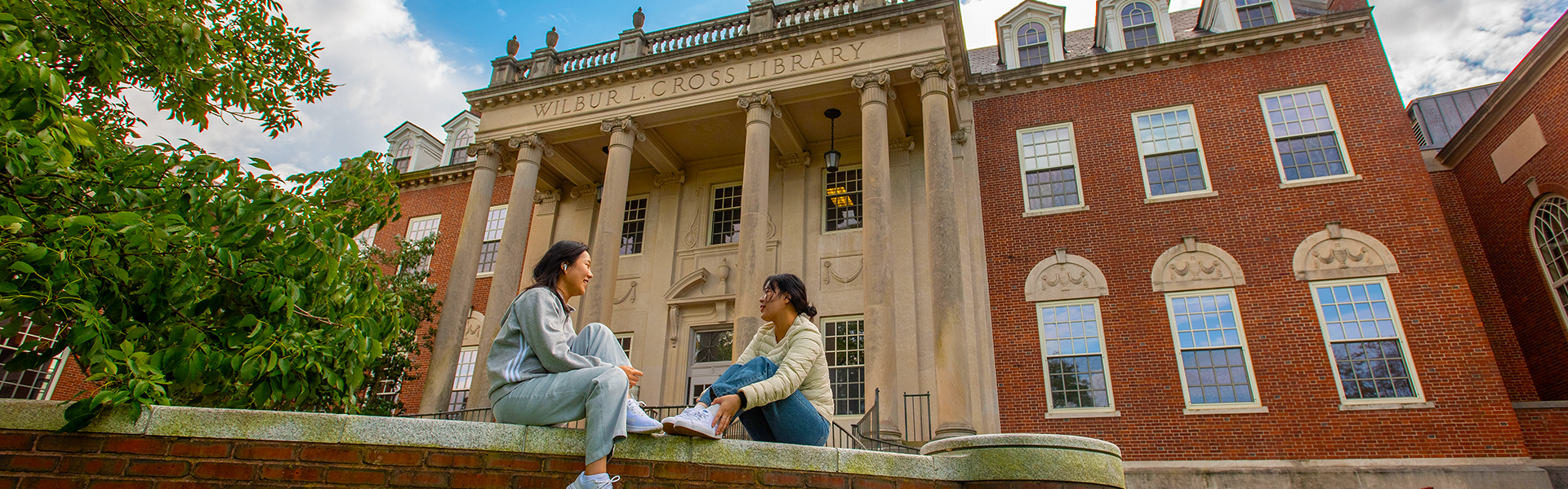 Students sitting outside Wilbur Cross Building, Storrs Students sitting outside Wilbur Cross Building, Storrs